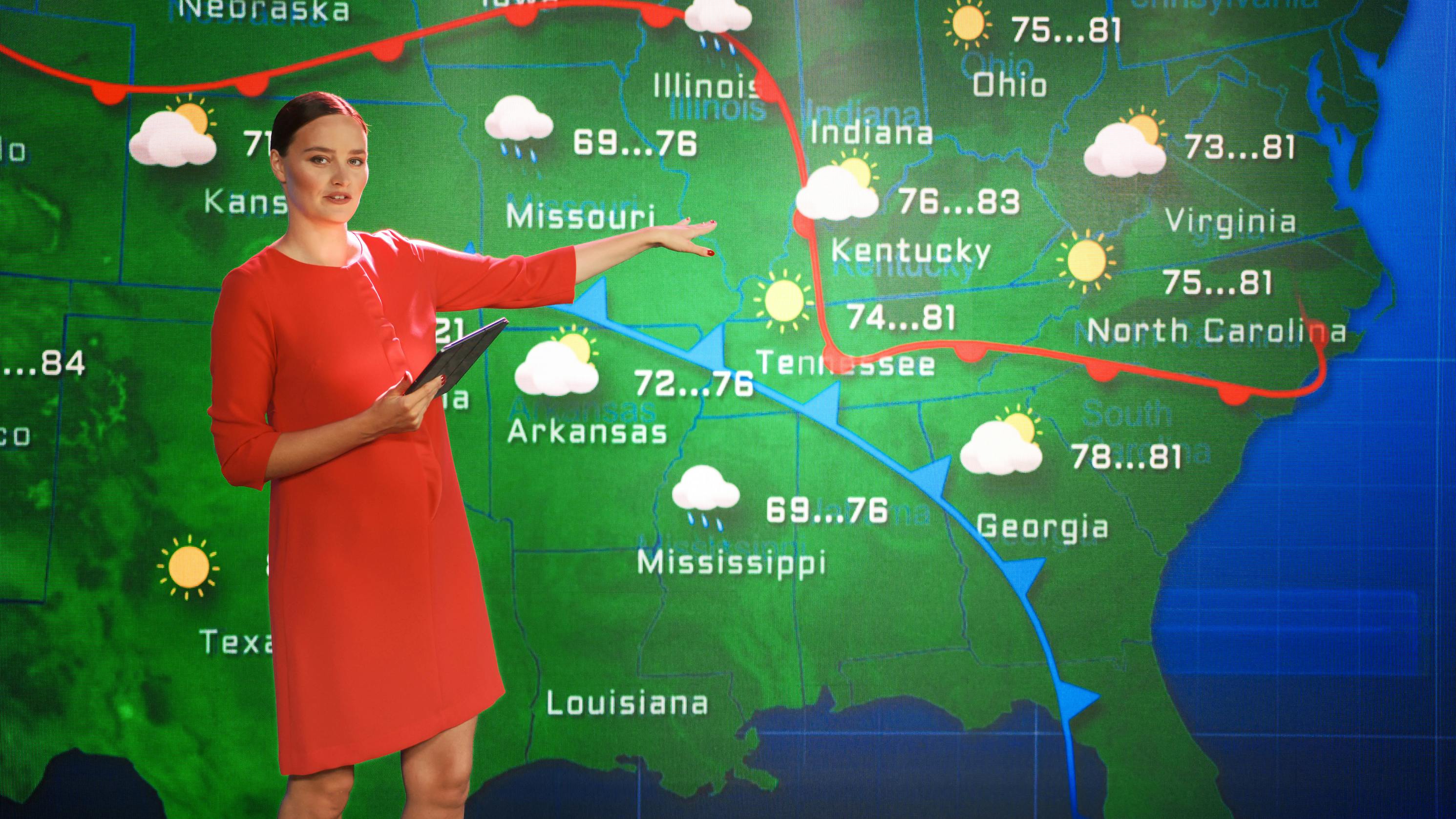 female meteorologist presenting the weather for TV