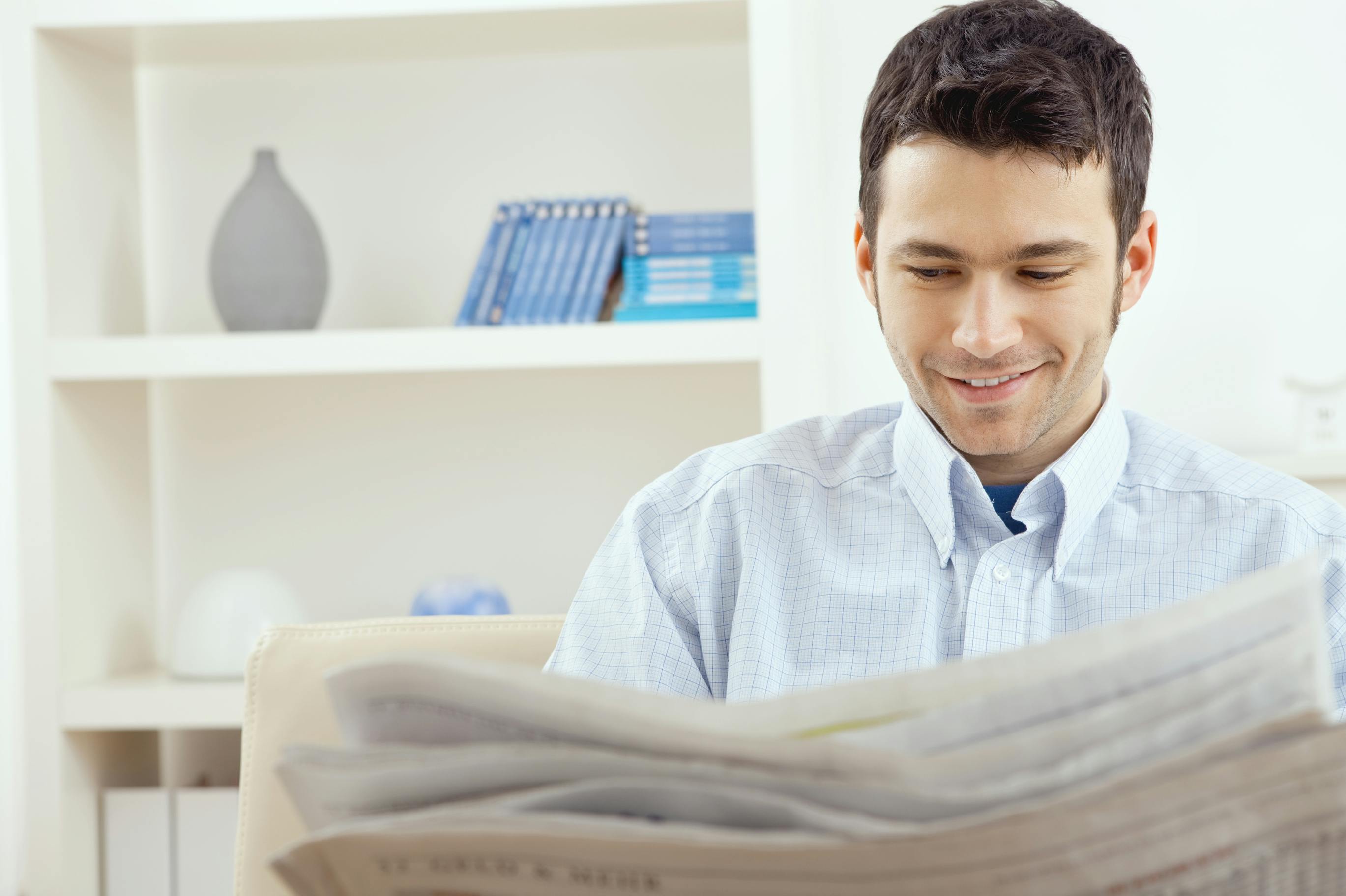 man reading newspaper