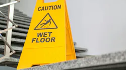 picture of caution wet floor sign in front of stairs